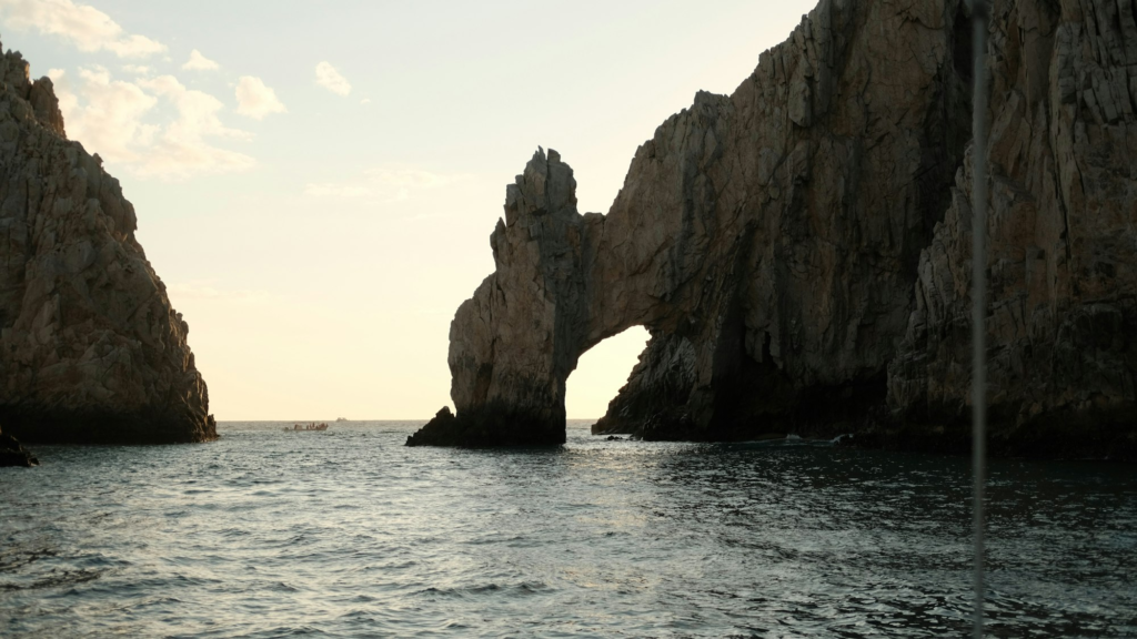 El Arco rock formation at sunset over the sea